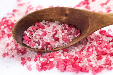 Wooden scoop with red sea salt for spa