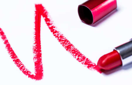 Red lipstick with trace over white backgroundの写真素材
