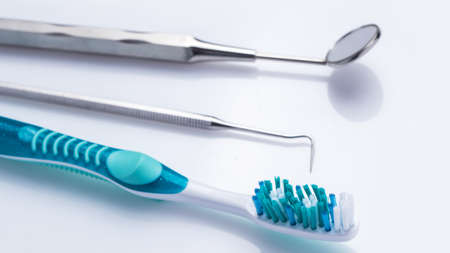 Dental equipment over white surfaceの写真素材