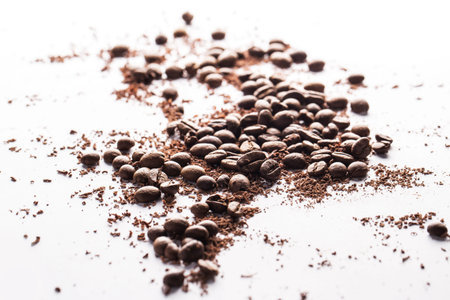 Close up of coffee beans and particles of black chocolate