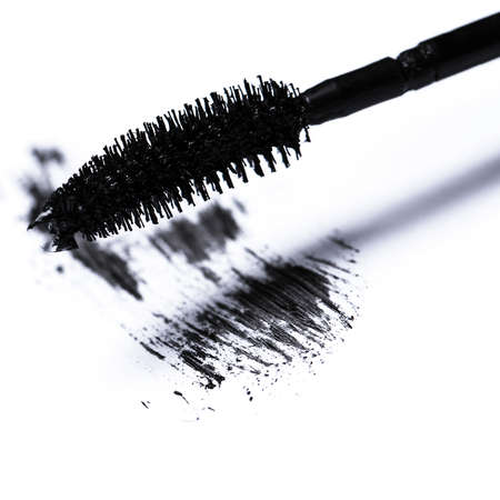 Closeup of mascara brush over white backgroundの写真素材