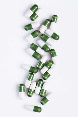 Colorful pills over bright backgroumdの写真素材