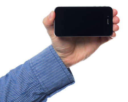 Holding smartphone overwhite backgroundの写真素材