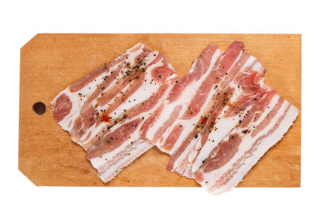 Fresh bacon on wooden boardの写真素材