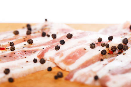 Fresh bacon on wooden boardの写真素材