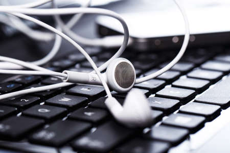 Smarthpone over laptop keybaordの写真素材