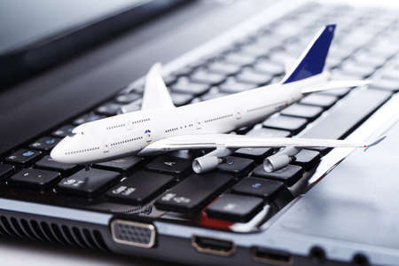 White aircraft over laptop keyboardの写真素材