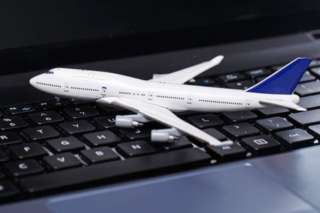 White aircraft over laptop keyboard