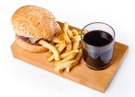 Burger, fries and carbonated drink over white backgroundの写真素材
