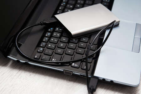External HDD over laptop keyboardの写真素材