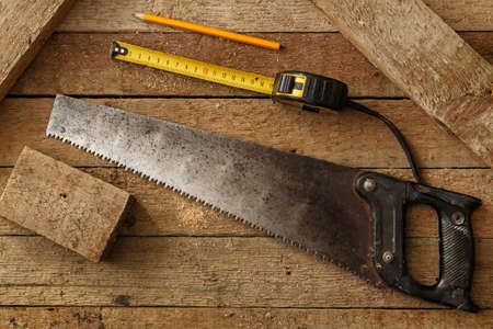 Carpentry tools on wooden surfaceの写真素材