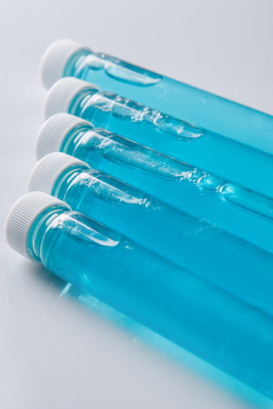 Small bottles with blue liquid