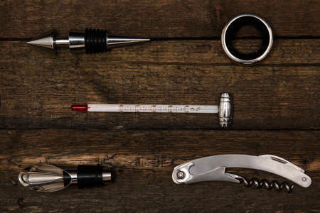 Different tools for wine over wooden surfaceの写真素材