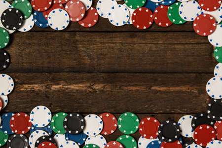 Poker cards and chips on wooden surfaceの写真素材