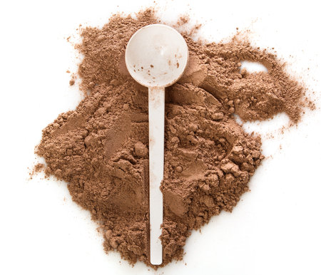 Close up of protein powder and scoop
