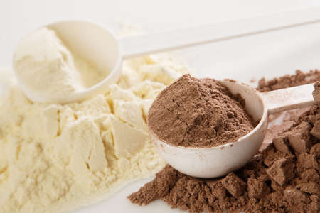 Close up of protein powder and scoopsの写真素材