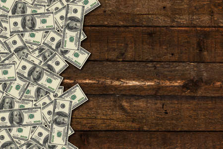 Dollar banknotes on wooden backgroundの写真素材