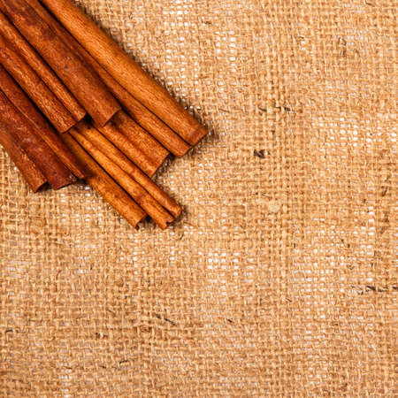 Cinnamon sticks on sackclothの写真素材