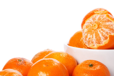 Fresh mandarins in bowl on white backgroundの写真素材