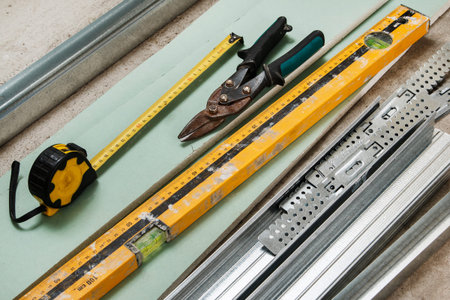 Different instruments and materials for build a plasterboard walls