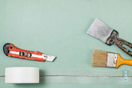 Reinforcing net and instruments over plasterboard surfaceの写真素材