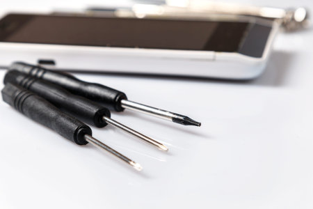 Smartphone and small screwdrivers for repair
