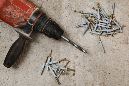 Drilling machine and dowels