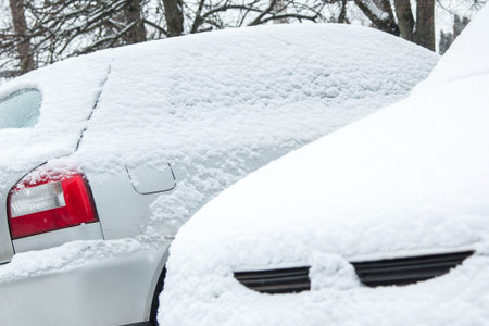 Close up of car covered with snowの写真素材