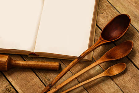 Wooden kitchen utensils on the tableの写真素材