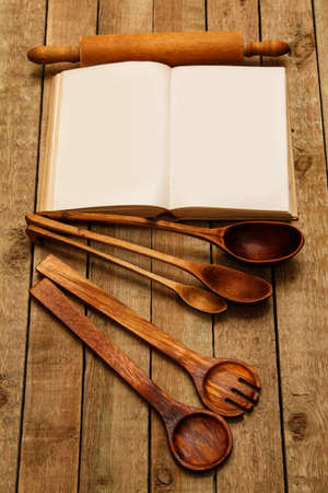Wooden kitchen utensils on the tableの写真素材