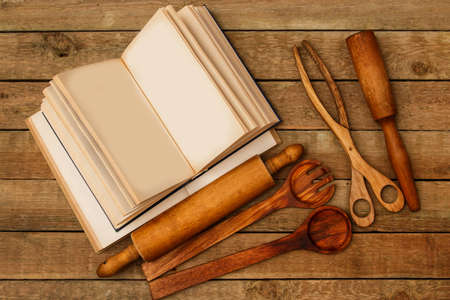 Wooden kitchen utensils on the tableの写真素材