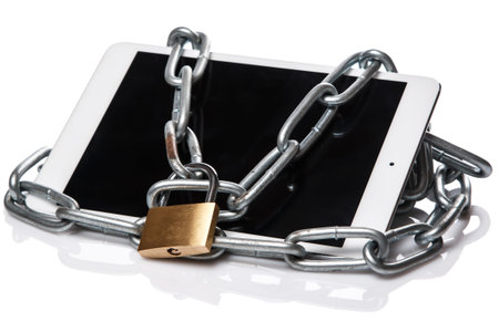 Tablet pc and padlock with chain over white background