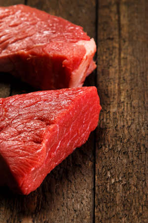 Raw meat on wooden tableの写真素材