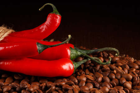 Red chili peppers and coffee beansの写真素材