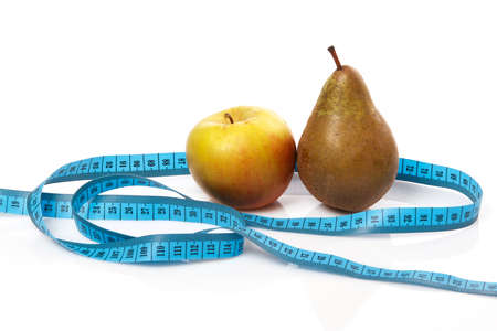 Fruits and measure tape on white backgroundの写真素材