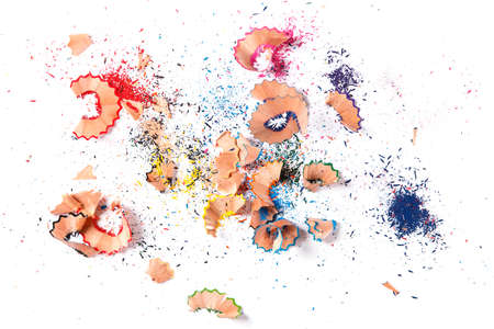 Shavings from multicolored pencils on white backgroundの写真素材