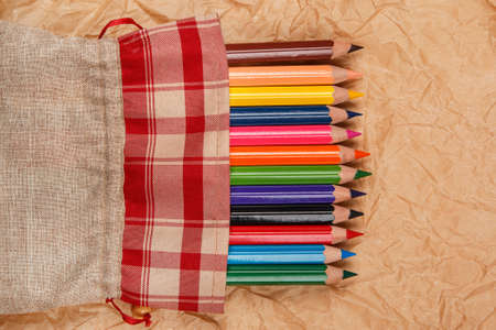 Multicolored pencils  over crumpled paper surfaceの写真素材