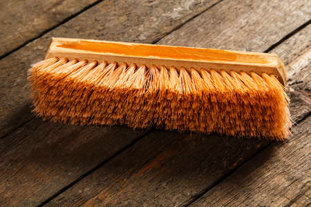 Brush over wooden floorの写真素材