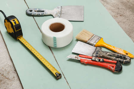 Reinforcing net and instruments over plasterboard surfaceの写真素材