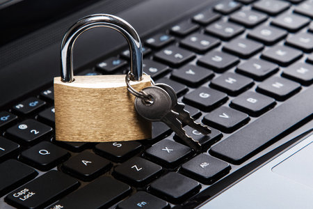 Padlock on a laptop keyboard. Concept of internet security