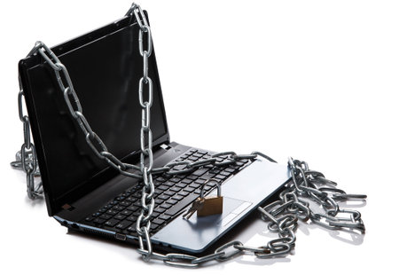 Padlock and chain on a laptop keyboard. Concept of internet security