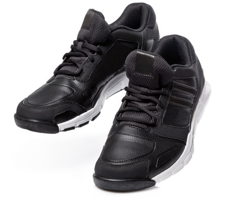 Black sport shoes on white backgroundの写真素材