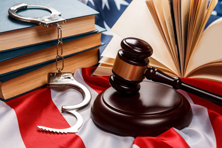 Gavel, books and handcuffs over american flag