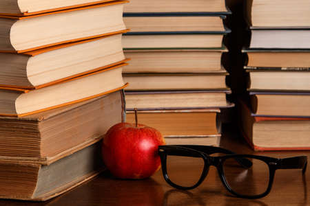 Red apple and old booksの写真素材