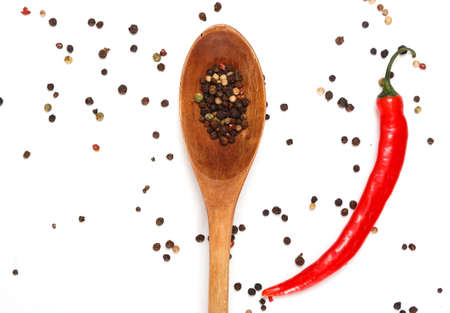 Red chili and dried pepper seeds on white backgroundの写真素材