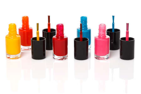 Bottles with a colorful nail polish on white backgroundの写真素材