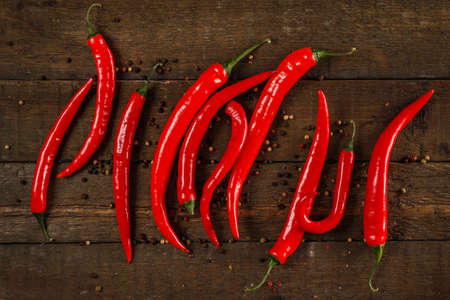 Red chili pepper on wooden tableの写真素材