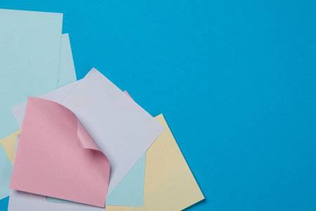 Colorful paper stickers on blue backgroundの写真素材