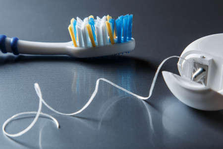 Close up of toothbrush and dental flossの写真素材