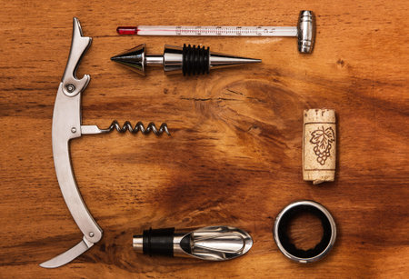 Different wine tools  on wooden surface